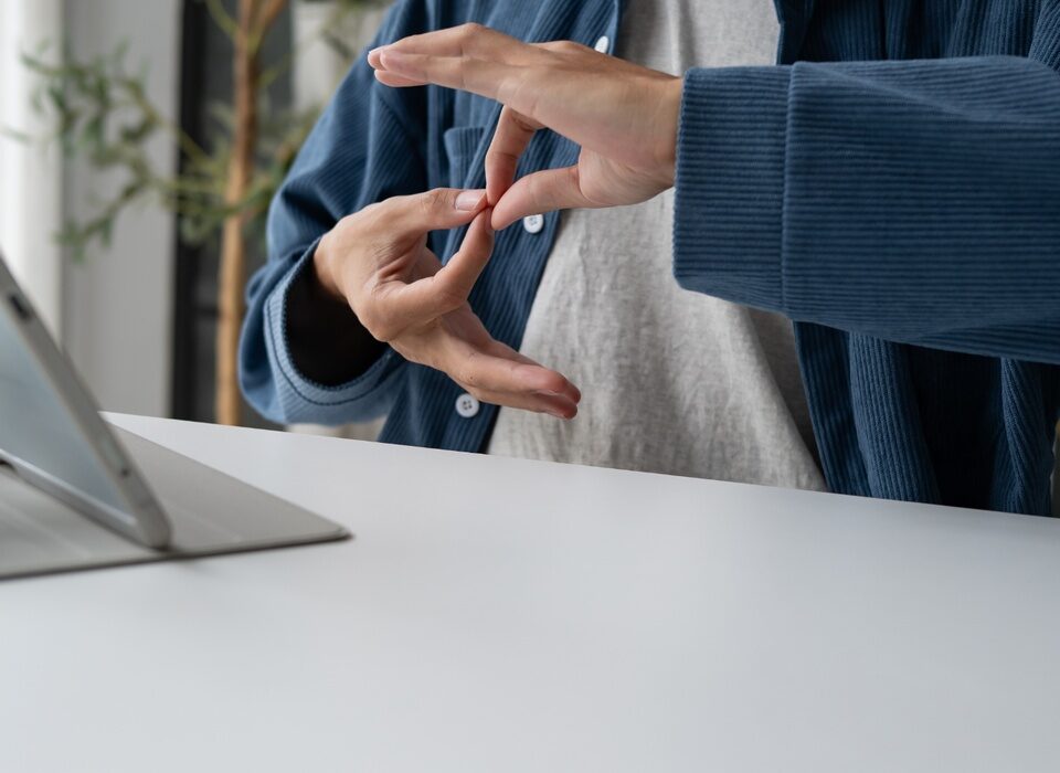 Person using sign language during video call on ta 2026 07 10 23 58 47 utc 1440x700